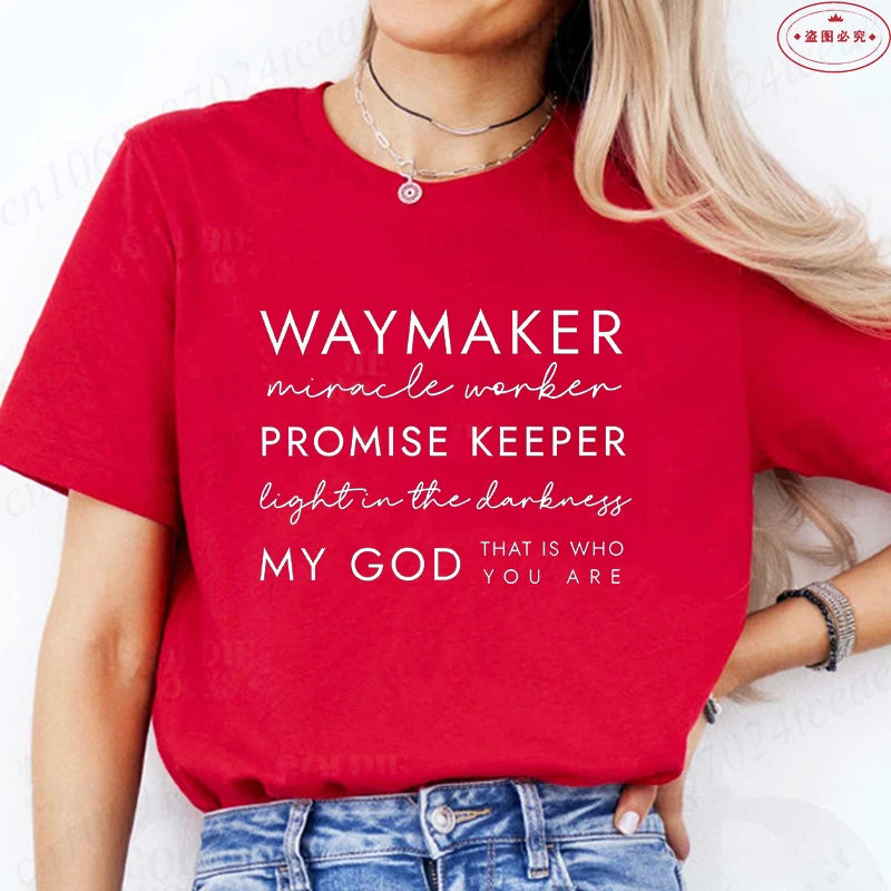 Person wearing a red t-shirt with motivational text on a white background