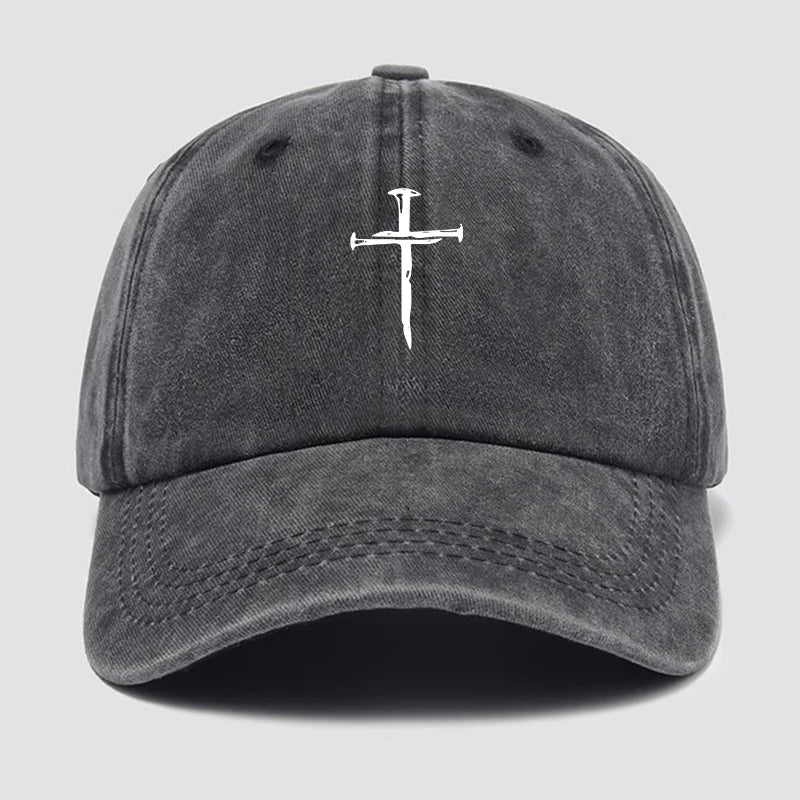 Gray cap with a white cross nail design on a light gray background